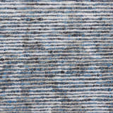 Close-up of the Nourison Ellora Slate rug. Features a textured, horizontal stripe pattern in taupe, blue, and gray.