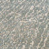 Close-up of Inspire Me! Home Decor Elegance Grey rug showing a speckled pattern of beige and blue.