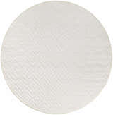 Close-up of the round Nourison Versatile Ivory White rug, featuring a subtle geometric diamond and chevron pattern.