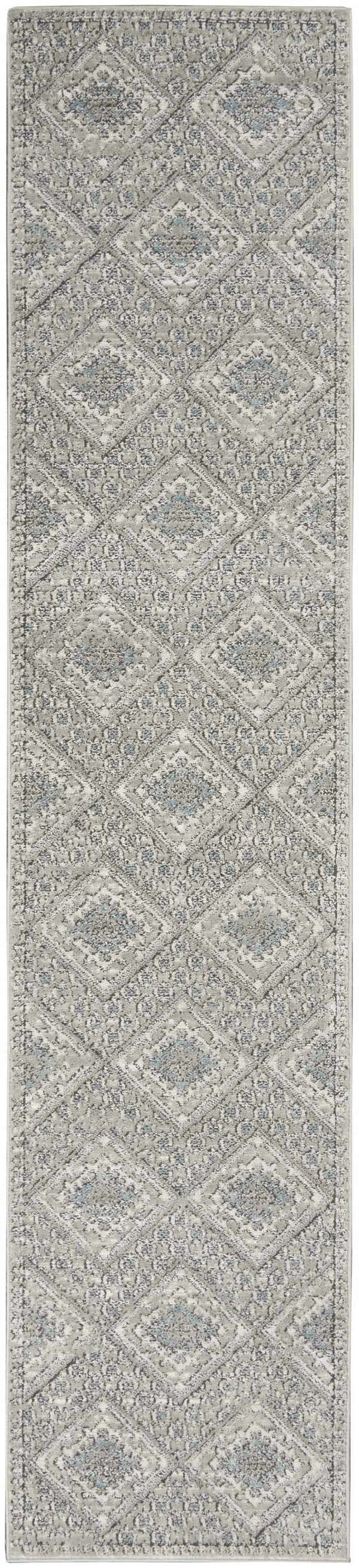 Close-up of Nourison Quarry Grey Ivory Blue Southwestern rug with diamond pattern and subtle chestnut accents.