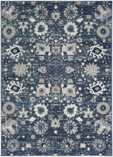 Close-up of the Nourison Passion Surf Bohemian Area Rug. Surf blue, gray, and white floral medallion pattern.