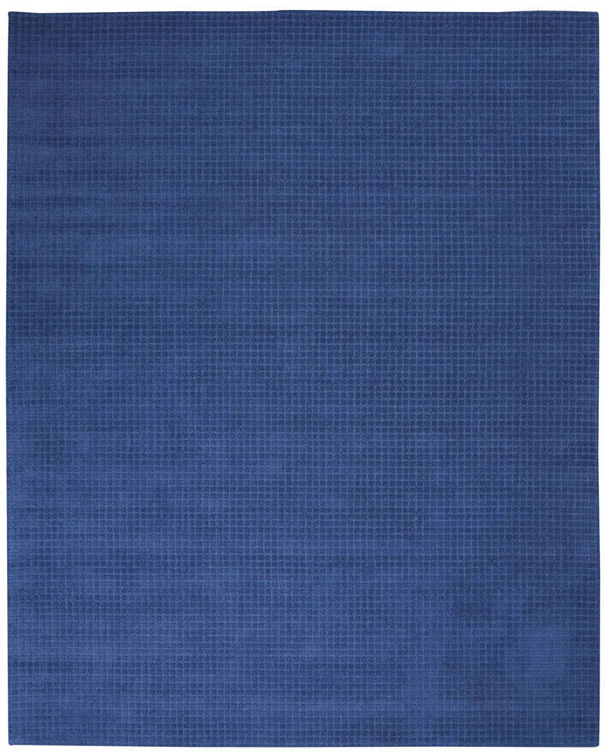 Close-up of the Calvin Klein Las Vegas Navy Retro Indoor Area Rug, showing a subtle grid pattern and wool texture.