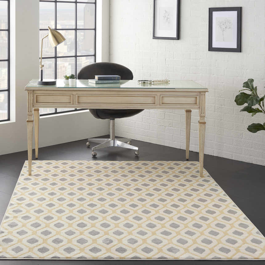 Contemporary office with Nourison Grafix White rug, desk, and city view. Modern, bright workspace design.