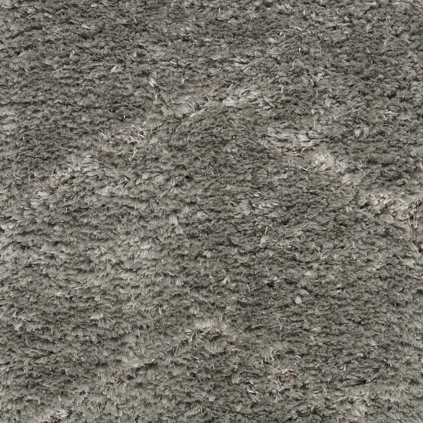 Close-up of the plush texture of the Nourison Dreamy Shag Grey Shag Indoor Area Rug.