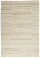 Close-up of the beige Calvin Klein Agadir shag rug. Handmade wool rug with a soft, textured pile and subtle horizontal stripes.