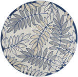 Round Nourison Aloha Ivory Navy Tropical Area Rug featuring a botanical leaf pattern in navy, gray, and cream.