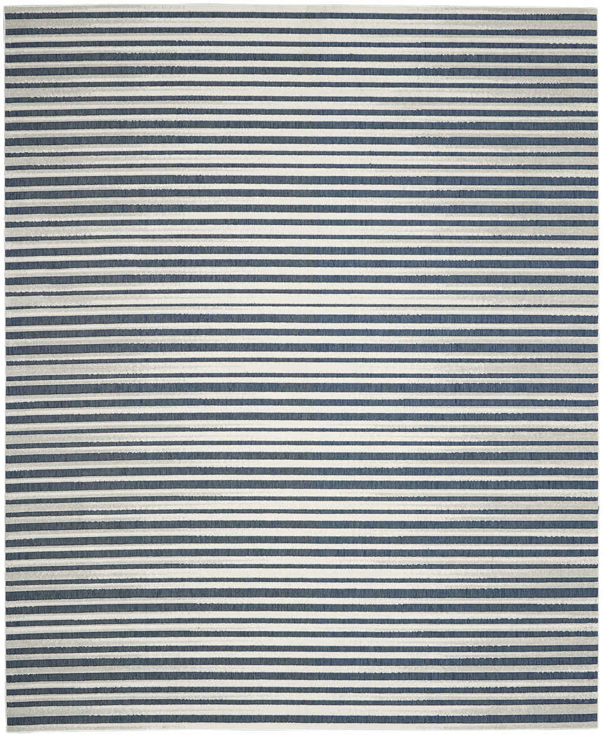 Close-up of the Nourison Key Largo Blue Contemporary Area Rug featuring a striped light blue and white design.