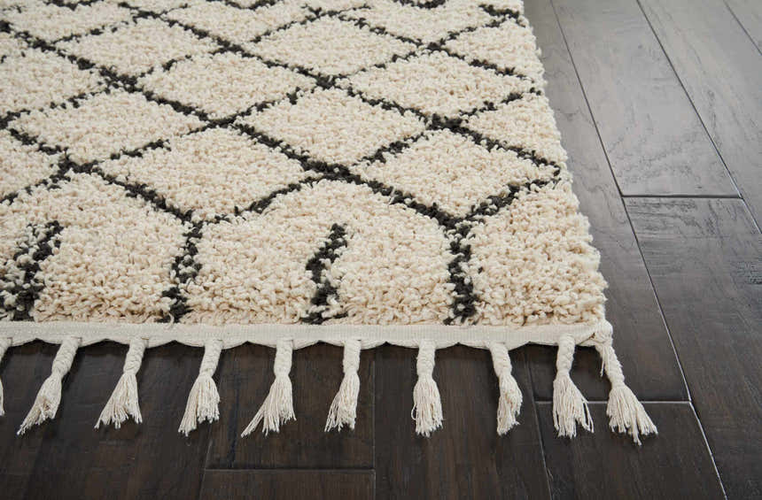 Close-up of the Nourison Moroccan Shag Cream Tribal rug showing its plush texture, diamond pattern, and fringe detail.
