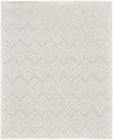 Close-up of the Nourison Versatile Ivory White rug. Features a modern geometric diamond and chevron pattern. Neutral texture.