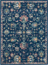 Close-up of Nourison Fusion Navy Pink Persian Indoor Area Rug featuring floral pattern and distressed texture.