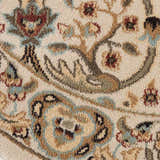 Close-up of the Nourison Walden Ivory Indoor Area Rug, featuring a floral chestnut, brown, and blue pattern.