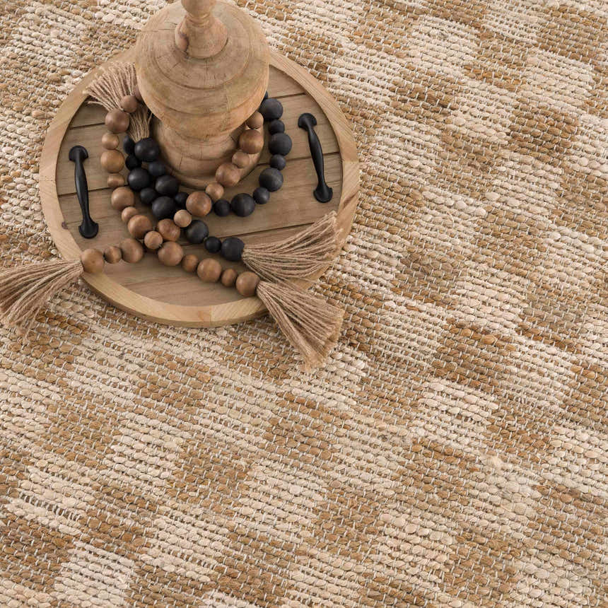 Close-up of beige and tan checkered Ionut Jute Area Rug. Hand woven texture detail. Farmhouse style. Styleshot