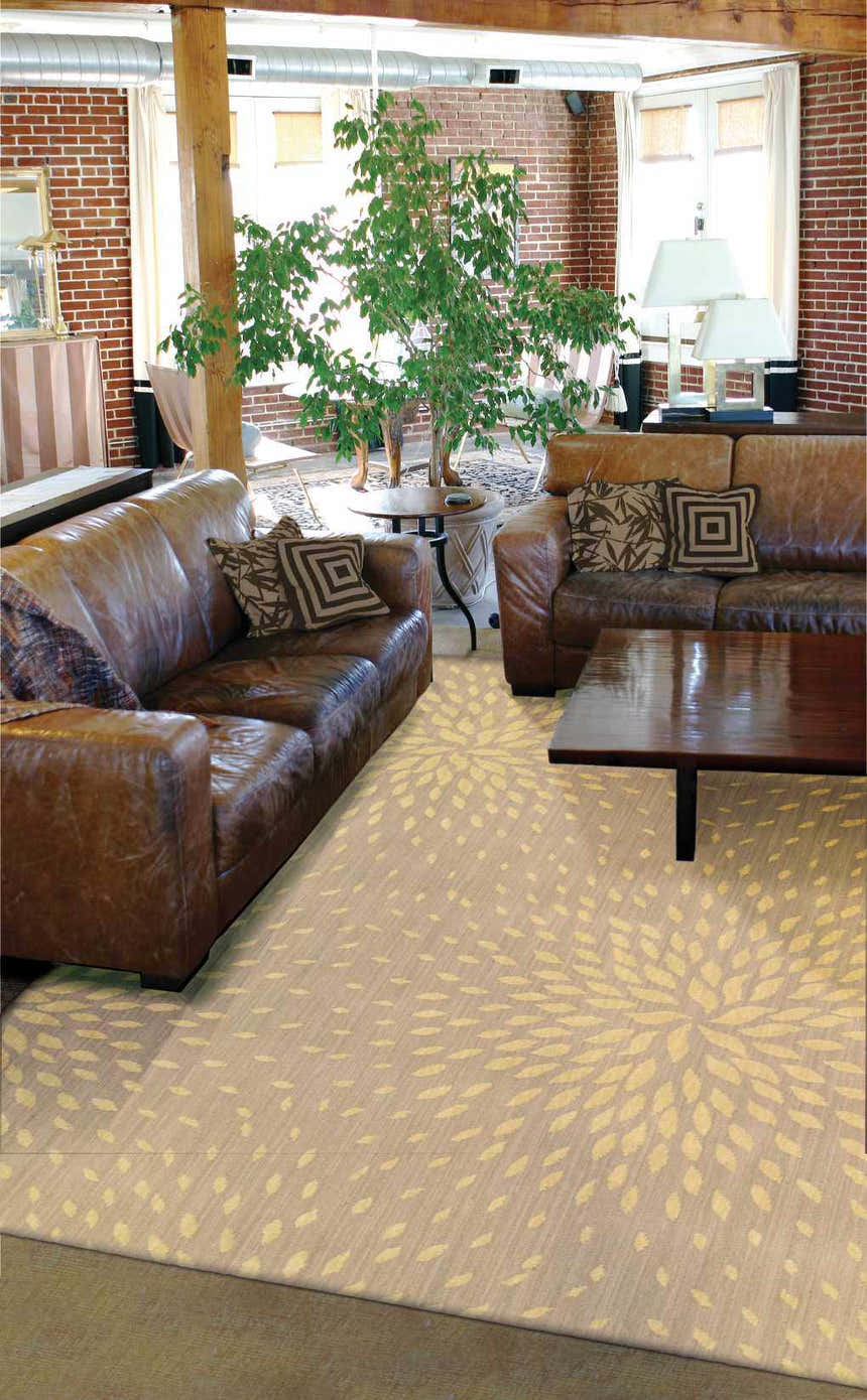 Loft living room with leather sofas and a Nourison Capri Beige Floral Indoor Area Rug.