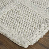 Close-up of Feizy Berkeley rug showing the ivory and gray wool, interlocking checkered texture, and hand woven construction. Corner