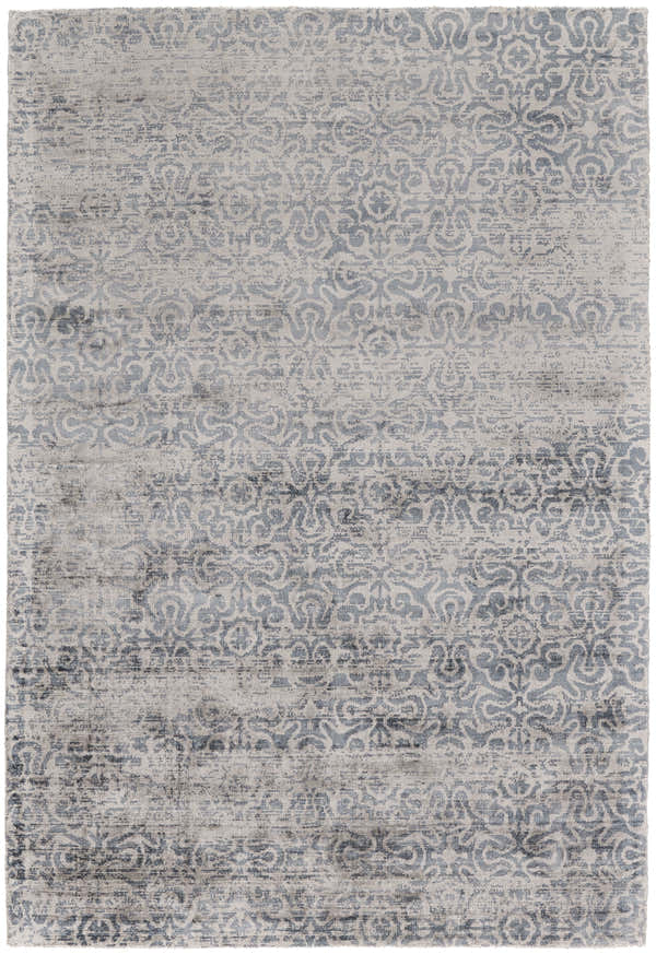 Close-up of the Feizy Nadia blue, gray, and taupe area rug. Transitional style with a distressed vintage pattern. Design-Rectangle