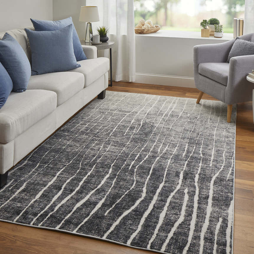 Living room with gray sofa, chair, and Feizy Kano black, gray, and ivory abstract area rug. Roomscene-Rectangle