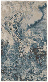 Close-up of Nourison Maxell Ivory/Teal rug. Abstract pattern in shades of teal, ivory, and chestnut. Modern design.