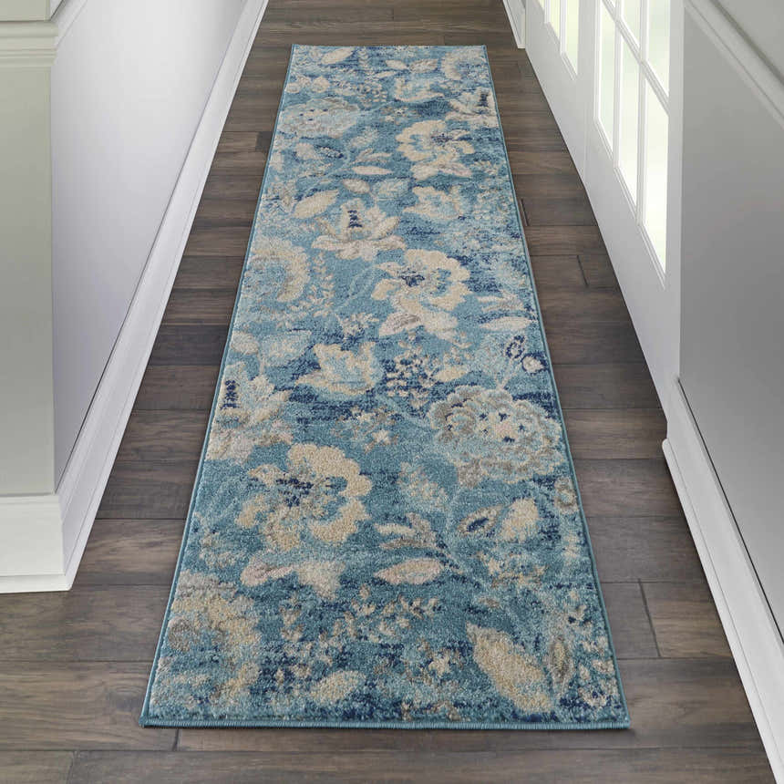 Hallway scene with Nourison Tranquil Turquoise Vintage Indoor Area Rug runner on dark wood floor. Aqua, beige floral pattern.