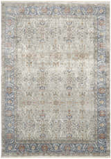 Close-up of the Nourison Starry Nights Grey Vintage Indoor Area Rug, showcasing its floral pattern and border detail.