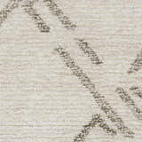 Close-up of Nourison Venosa Ivory/Grey rug. Mid-century modern design with chestnut jute and rayon texture. Handmade rug detail.