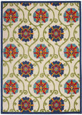 Close-up of Nourison Aloha Blue Multicolor rug. Floral pattern in blue, red, orange, and green on a light background.