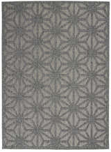 Close-up of Nourison Cozumel Dark Grey rug. Mid-century modern style with geometric star pattern in shades of gray.
