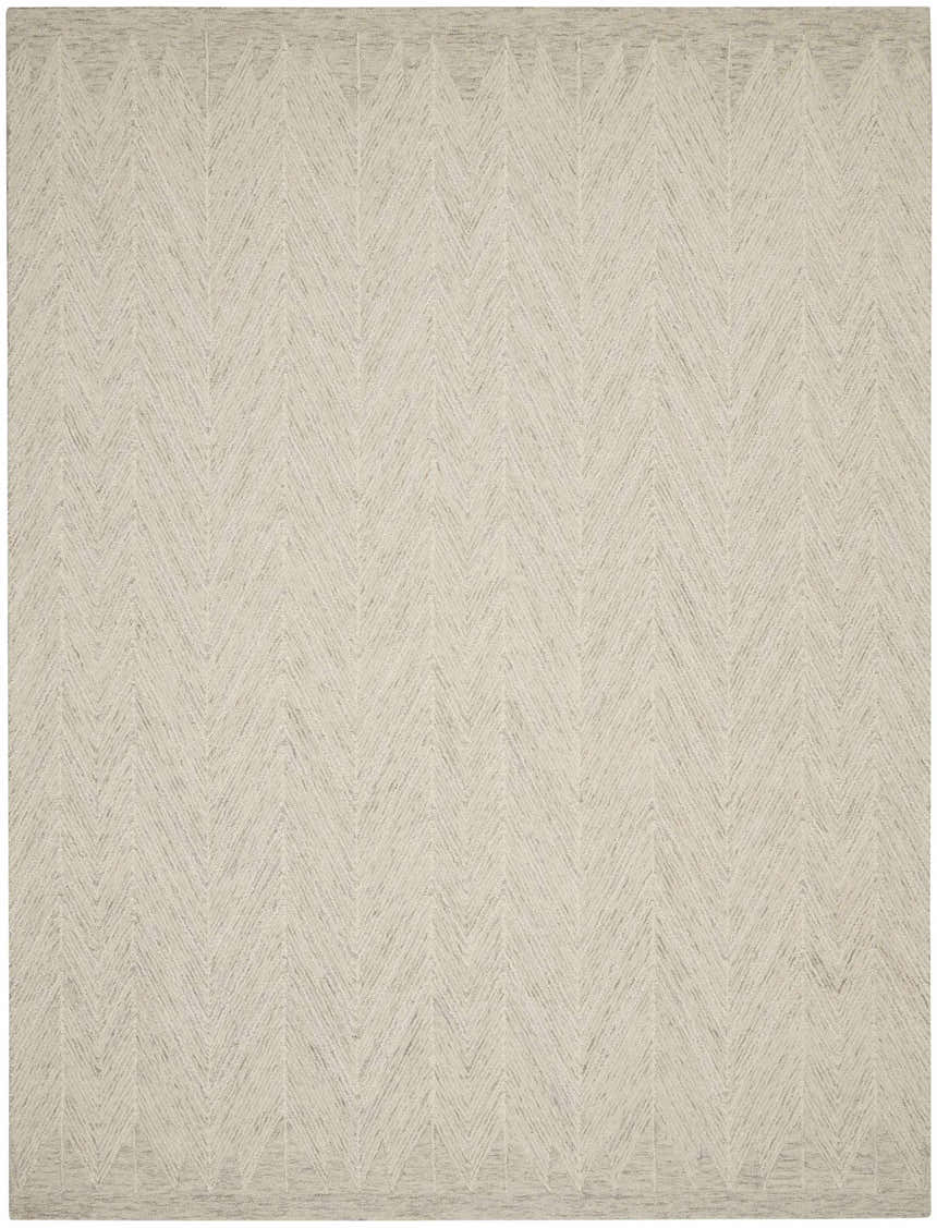 Close-up of the Nourison Interlock Ivory/Grey rug. Handmade wool rug with a modern chevron pattern.