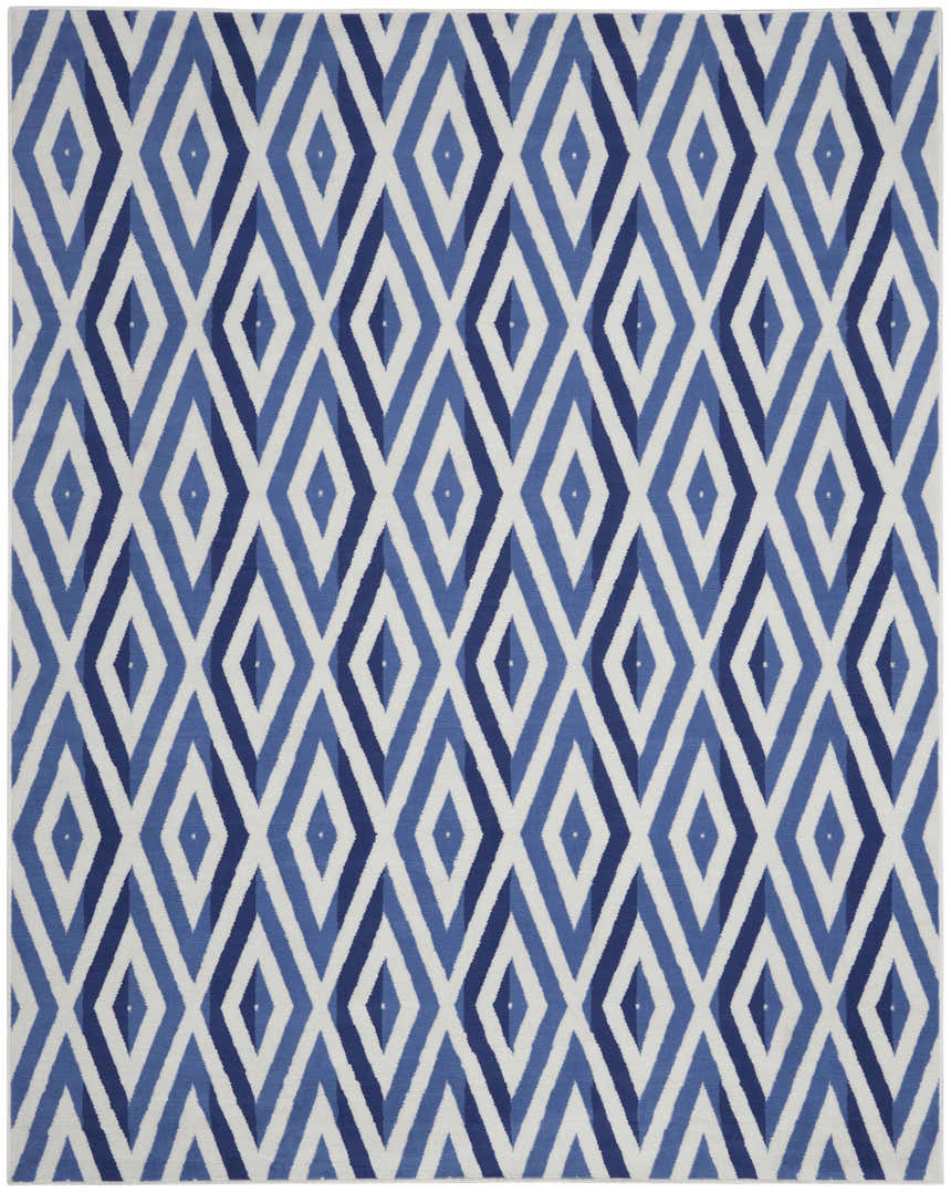 Close-up of the Nourison Whimsicle Ivory Blue rug featuring a diamond pattern in shades of blue and white.