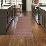 Modern kitchen with Nourison Essentials Mocha runner rug on hardwood floors.