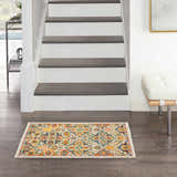 Entryway with Nourison Allur Ivory Multicolor rug, dark wood floors, white stairs, and modern white bench.
