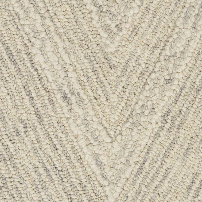 Close-up of the looped texture and chevron pattern on the Nourison Interlock Ivory/Grey area rug.