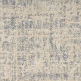 Close-up of Calvin Klein CK030 Currents Beige Grey rug. Modern design with subtle gray pattern and soft beige texture.