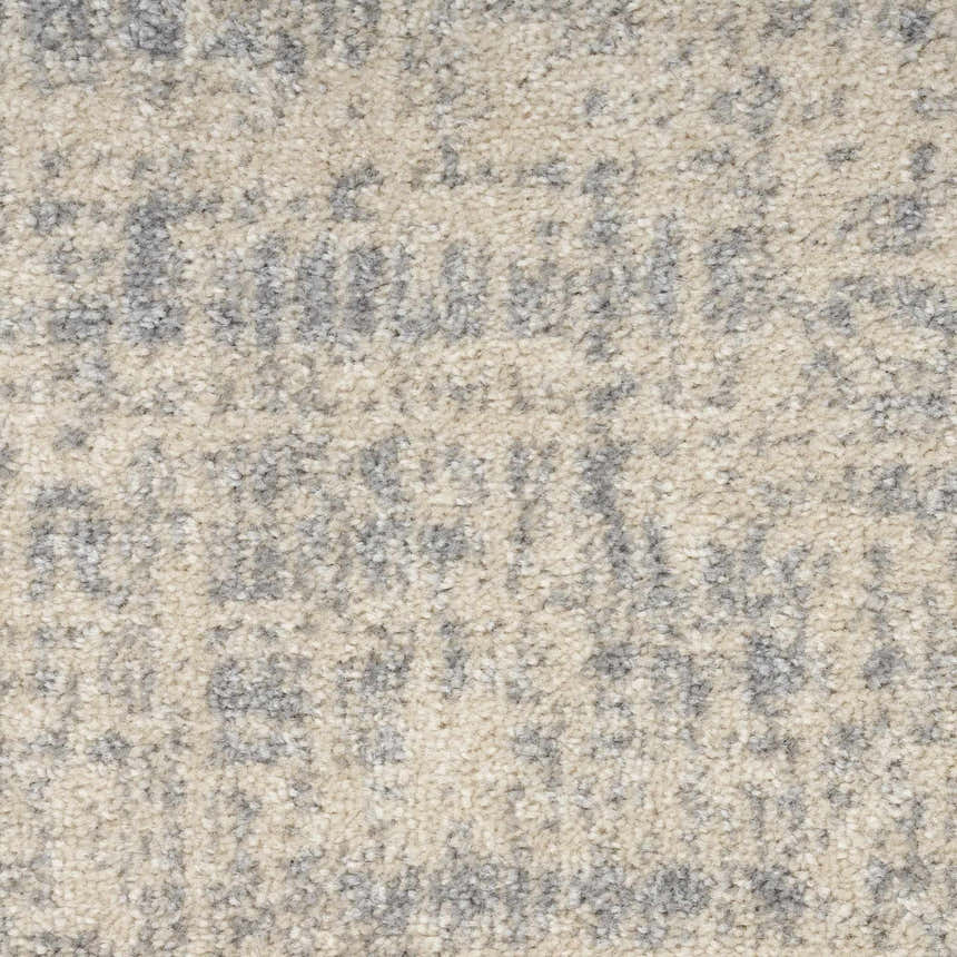 Close-up of Calvin Klein CK030 Currents Beige Grey rug. Modern design with subtle gray pattern and soft beige texture.