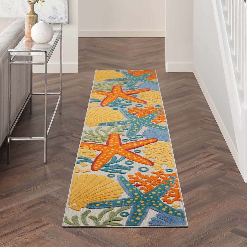 Hallway with Nourison Aloha Multicolor rug runner featuring starfish and seashell coastal design.