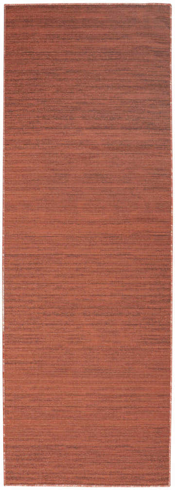 Close-up of Nourison Essentials Brick Modern Indoor Washable Area Rug. Brick red color with subtle horizontal texture.