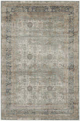 Close-up of the Nourison Malta Cloud Vintage Area Rug, featuring a distressed floral pattern in cloud, tan, and navy.