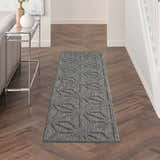 Hallway styled with Nourison Cozumel Dark Grey runner rug. Modern geometric design on wood floors.