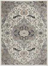 Close-up of the Nourison Elation Ivory Grey rug. Features a traditional floral pattern in ivory, grey, and chestnut. High pile texture.