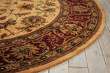 Close-up of the round Nourison Jaipur Light Gold rug, showcasing its floral pattern and wool texture.