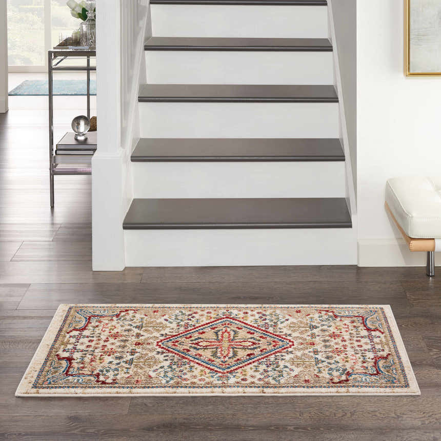 Entryway with Nourison Karisma Ivory rug, farmhouse style. Chestnut, red, and blue design on a neutral background.