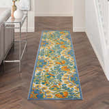 Hallway with Nourison Aloha Multicolor Transitional Area Rug runner, floral pattern, wood floors, and console table.