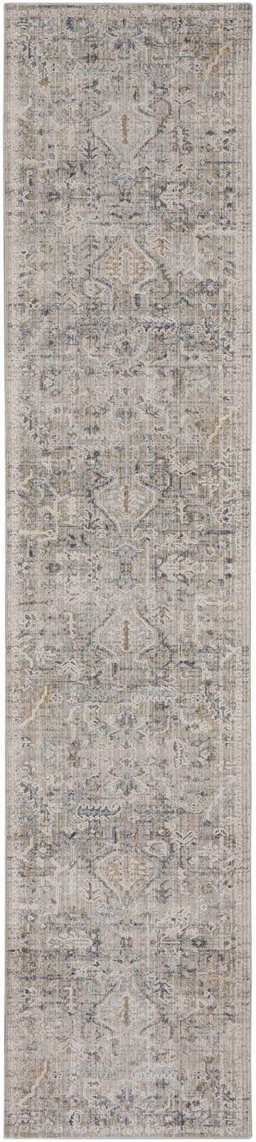 Close-up of Nourison Lynx Ivory Taupe rug. Vintage design with ivory, taupe, and blue tones. Distressed pattern and soft texture.