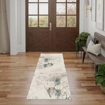 Entryway with wood floors, bench, and Nourison Desire Ivory Grey Blue Rug runner.