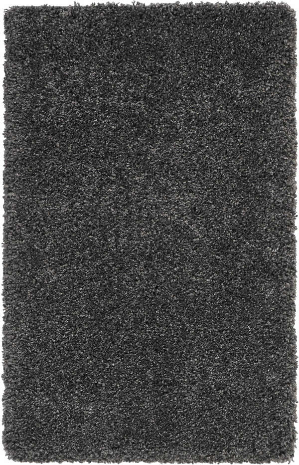 Close-up of the plush texture of the Nourison Malibu Shag Dark Grey rug. Soft, dense pile in medium gray tones.