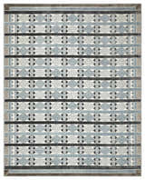 Close-up of Nourison Nordic Blue Rug. Modern design with light blue, gray, and black geometric pattern.