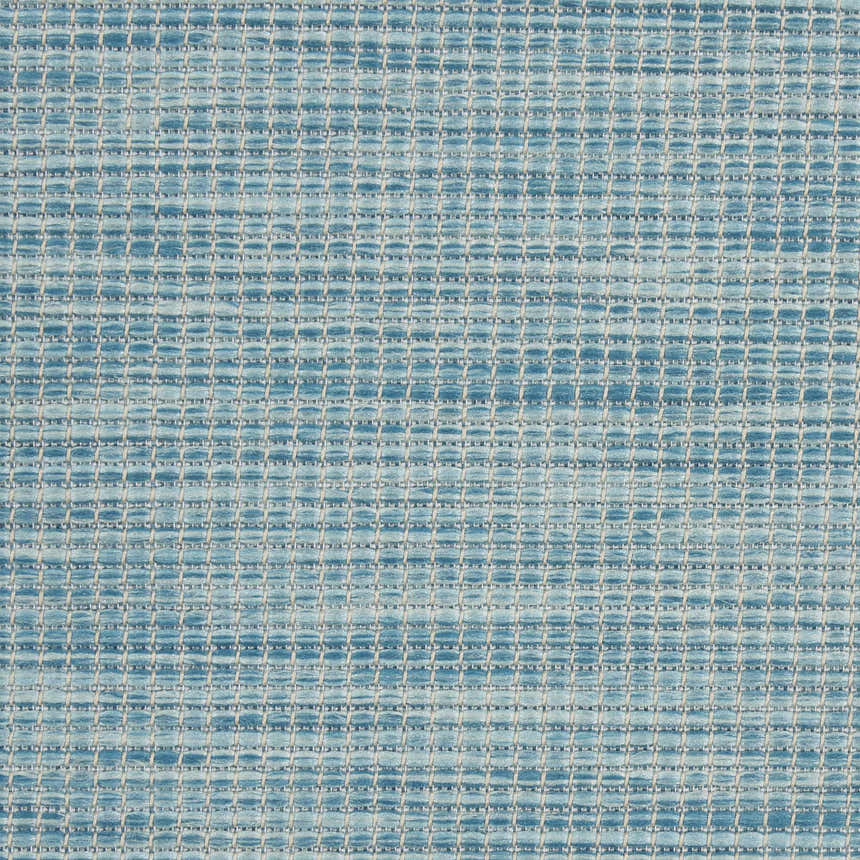 Close-up of Nourison Positano Aqua rug showing woven texture and grid pattern in shades of aqua and light beige.