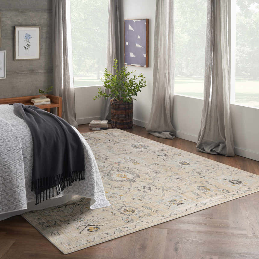 Serene bedroom scene with Nourison Oushak Home Cream Vintage Area Rug, wood floors, and natural light.