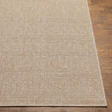 Close-up of the Vanderhoof Indoor & Outdoor Rug. Mocha and light peach tones with a subtle geometric pattern. Front