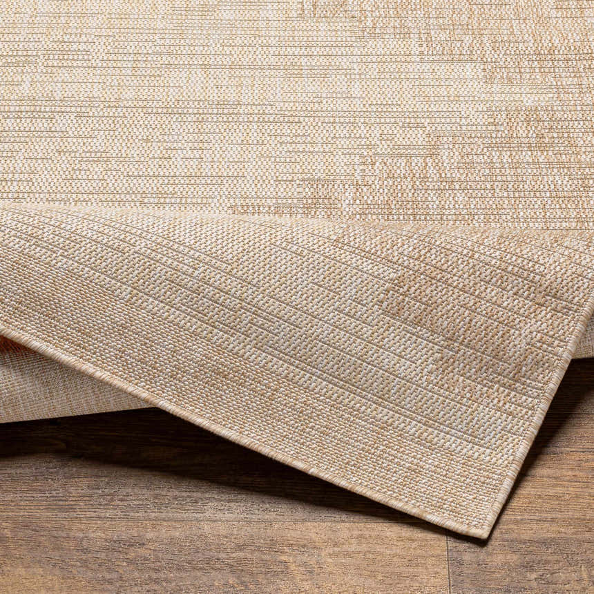 Close-up of the Djugun Beige Indoor & Outdoor Rug showing its woven texture and neutral beige and bone color palette. Fold