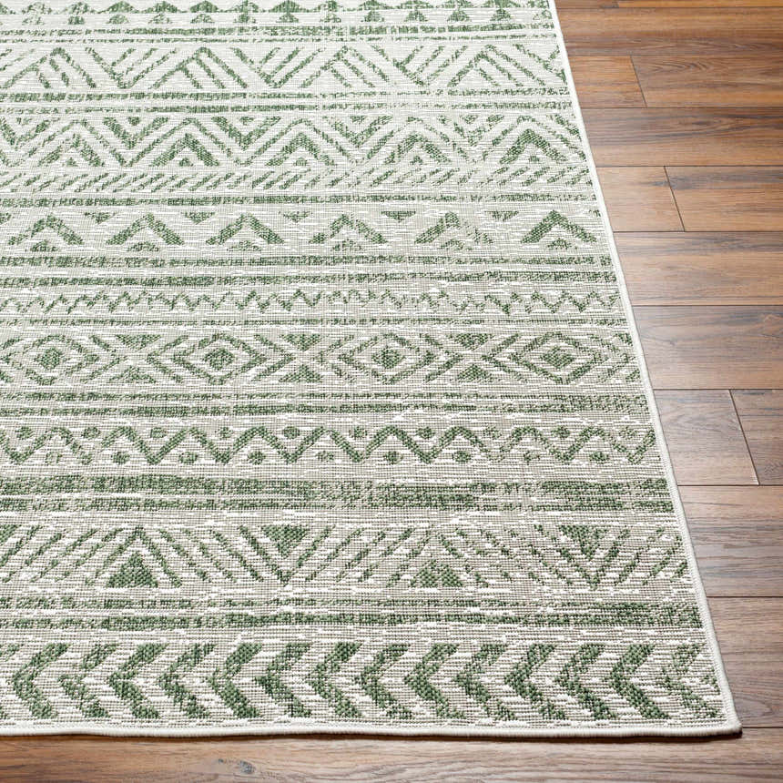 Close-up of Novato Olive All Over Pattern Performance Rug showing olive green geometric design and woven texture. Front